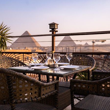 Hotel Pyramids Gem Plaza à Kafret el-Gabal Extérieur photo
