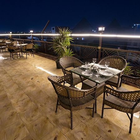 Hotel Pyramids Gem Plaza à Kafret el-Gabal Extérieur photo