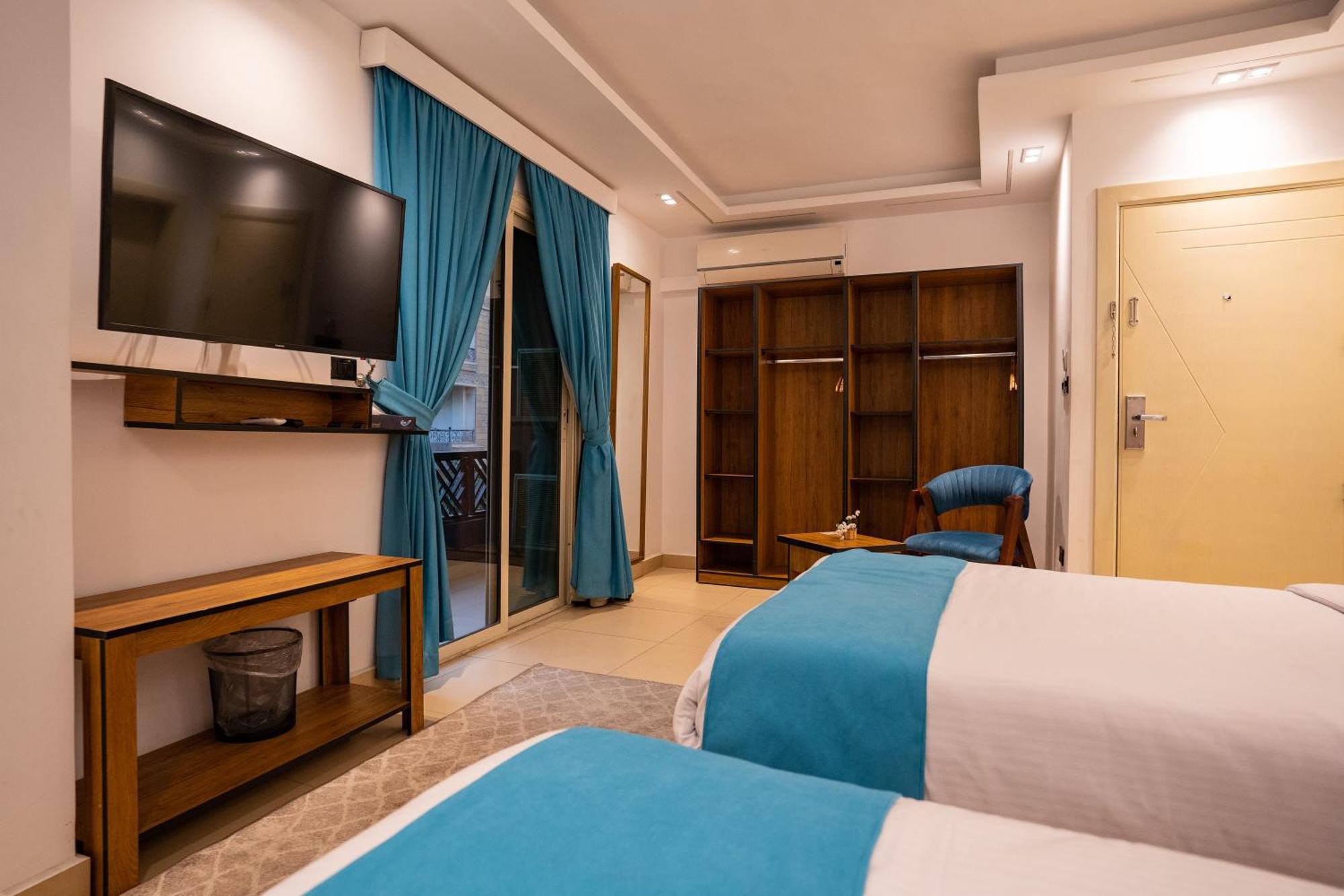 Hotel Pyramids Gem Plaza à Kafret el-Gabal Extérieur photo